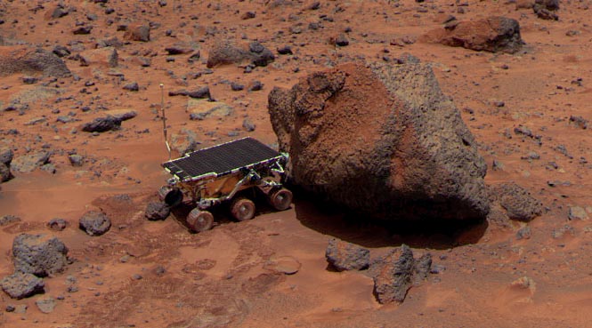 Sojourner investigates a rock named "Yogi Bear" (NASA/JPL-Caltech)