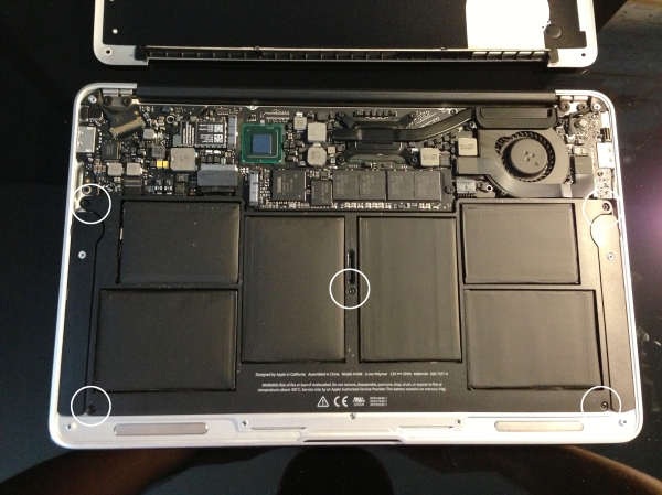 Most of the inside is taken up by the battery itself. Mid-2011 models have 5 screws - remove these.