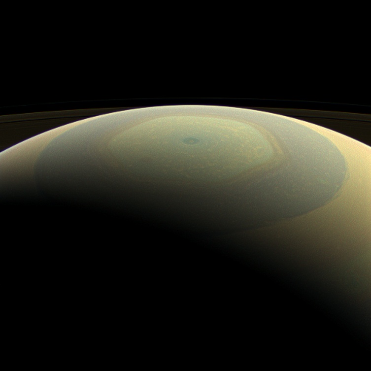 Saturn makes a beautifully-striped ornament in this natural-color image, showing its north polar hexagon jet stream and central vortex (Credit: NASA/JPL-Caltech/Space Science Institute)