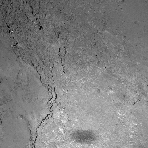 Close view of a 228 x 228 meter region on Comet 67P/C-G. Rosetta's shadow can be seen at the bottom. (ESA/Rosetta/MPS for OSIRIS Team MPS/UPD/LAM/IAA/SSO/INTA/UPM/DASP/IDA)