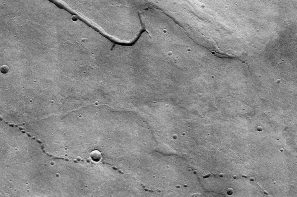 THEMIS image of collapse pits on Mars above potential lava tubes (NASA/JPL/ASU)