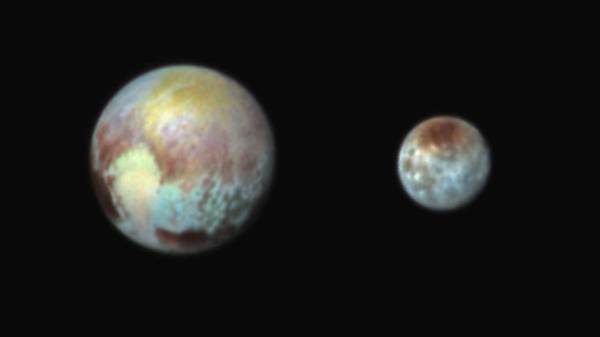 False-color image of Pluto and Charon highlights regional color variations on the two worlds (NASA/APL/SwRI)