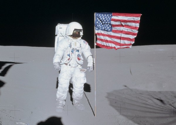 Edgar Mitchell poses next to the U.S. flag on the Moon during Apollo 14, Feb. 1971 (NASA)