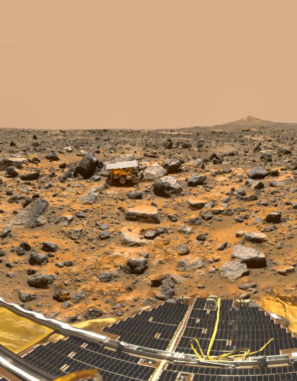 A true-color panorama of Pathfinder's Ares Vallis landing site captured from the Mars Pathfinder lander. The image shows the Pathfinder rover, Sojourner, snuggled against a rock nicknamed Moe. The south peak of two hills, known as Twin Peaks, can be seen on the horizon, about 1 kilometer away. (Credit: NASA/JPL)